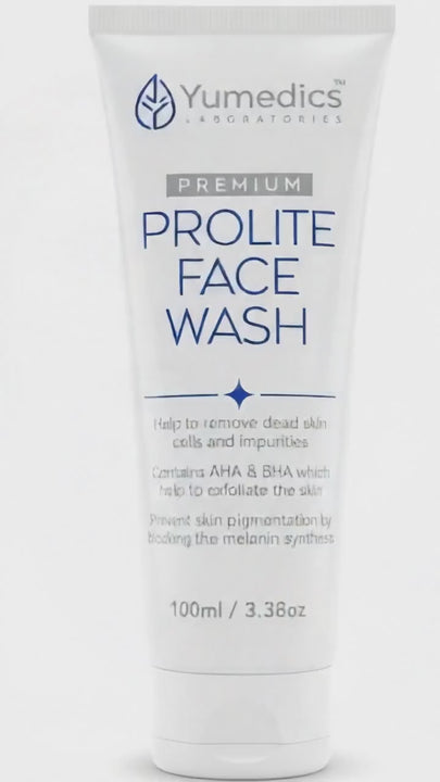 Video showing the step-by-step use of Yumedics Prolite Face Wash. First clip shows a young woman examining dark spots and acne on her face in a bathroom mirror. Next clip shows a hand holding the white Yumedics Prolite Face Wash tube, then squeezing clear gel. The next shot shows rich white foam lather being gently applied over her face. The video ends with a product pedestal display highlighting AHA and BHA ingredients for fading pigmentation.